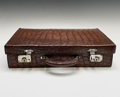 Lot 419 - An early 20th century crocodile skin briefcase...
