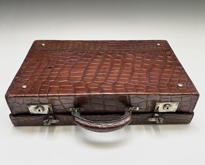 Lot 419 - An early 20th century crocodile skin briefcase...