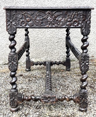Lot 2 - A 17th century carved walnut side table, the...