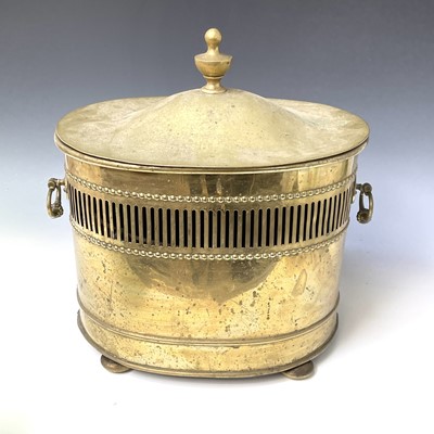 Lot 440 - An oval brass Regency style coal bin and cover,...