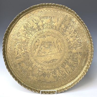 Lot 449 - An Indian circular brass tray, engraved with...