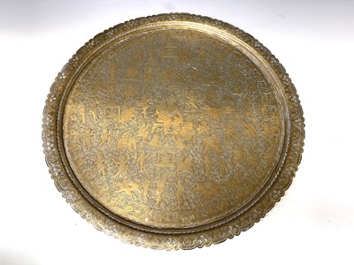 Lot 449 - An Indian circular brass tray, engraved with...