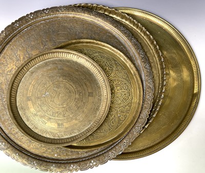 Lot 449 - An Indian circular brass tray, engraved with...