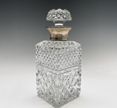 Lot 944 - A silver mounted cut glass decanter and...