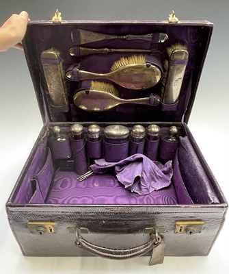 Lot 46 - A purple leather toilet case by Mappin and...
