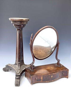 Lot 3183 - A mahogany candle stand, formed with the base...