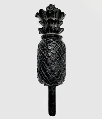 Lot 389 - A carved ebony pineapple finial, probably 18th...