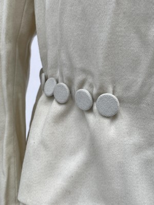 Lot 2852 - A ladies Edwardian cream wool suit, cream silk...