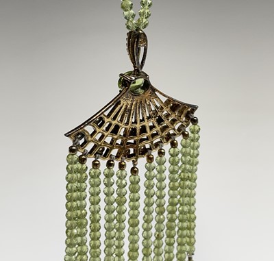 An Egyptian revival silver-gilt pendant with...
