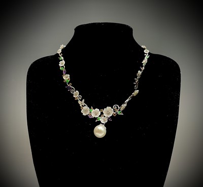 Lot 244 - An opulent floral necklace set in silver with...