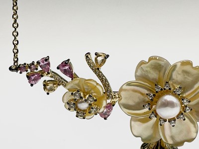 A voluptuous silver-gilt necklace with a...