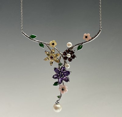 A naturalistic necklace with entwined...