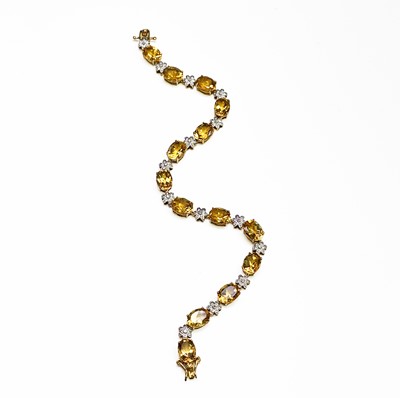 A 10ct gold bracelet with diamond centered...
