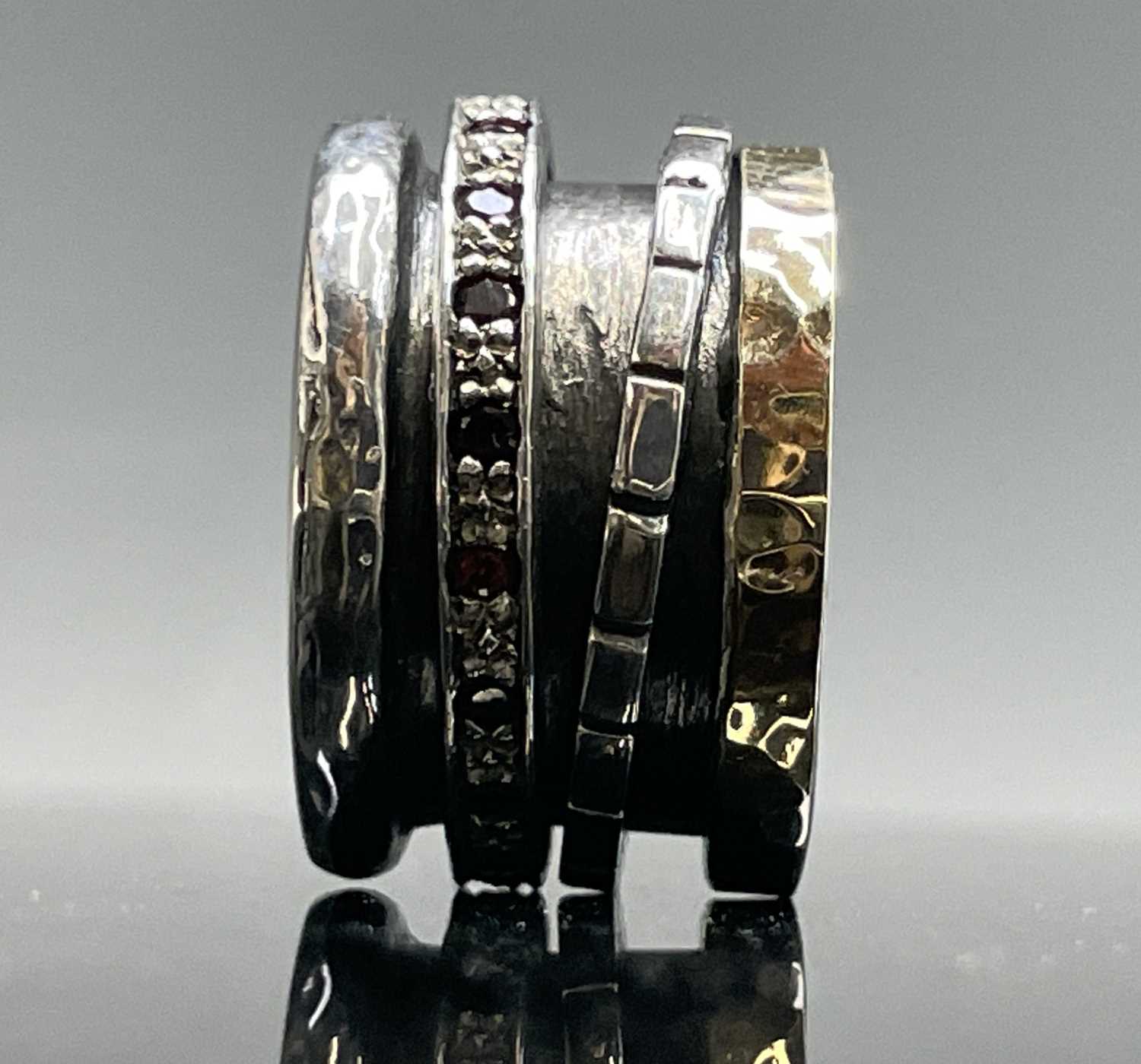 Lot 260 - A contemporary silver ring with a gold band