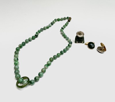 Lot 220 - A Chinese jade necklace, with graduated beads,...