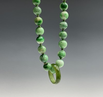 Lot 220 - A Chinese jade necklace, with graduated beads,...