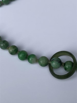 Lot 220 - A Chinese jade necklace, with graduated beads,...