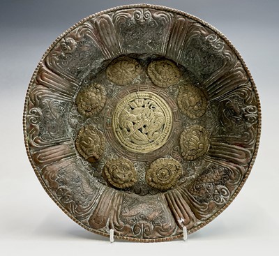 Lot 223 - A Tibetan copper and brass dish, late 19th...