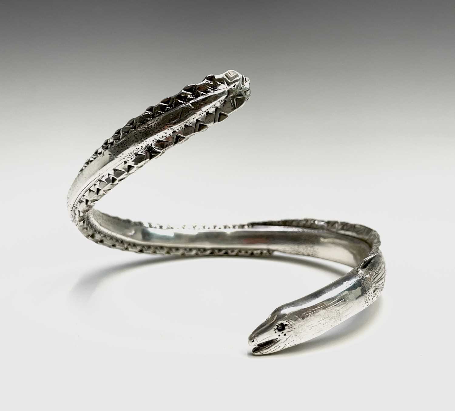 Lot 268 - A heavy naturalistic .999 pure silver 'Eel'...