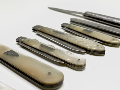 Lot 53 - Seven folding silver fruit knives and a silver-...