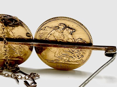 Lot 345 - Two gold sovereigns mounted on a 9ct gold...