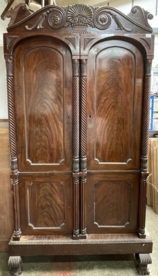 Lot 3210 - A Regency mahogany wardrobe, the pair of...