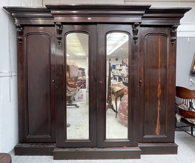 Lot 3218 - A Victorian mahogany triple wardrobe, overall...