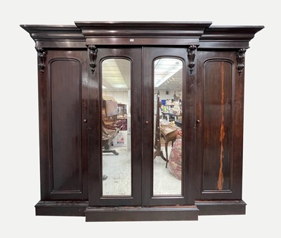 Lot 3063 - A Victorian mahogany triple wardrobe, overall...