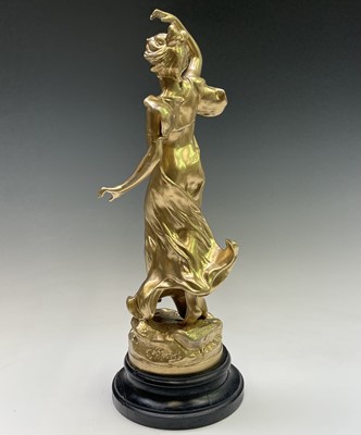 Lot 455 - A French gilt spelter figure of a lady, signed...