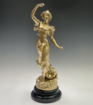 Lot 455 - A French gilt spelter figure of a lady, signed...