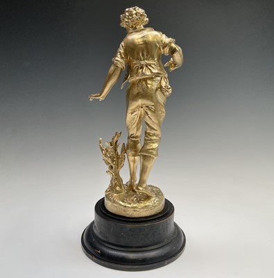 Lot 455 - A French gilt spelter figure of a lady, signed...