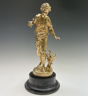 Lot 455 - A French gilt spelter figure of a lady, signed...