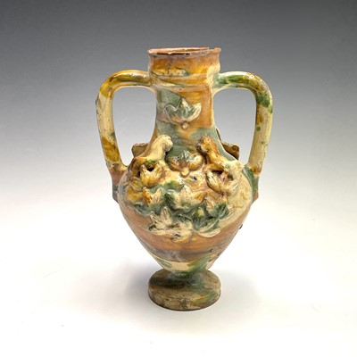 Lot 949 - A Continental pottery twin handled urn,...