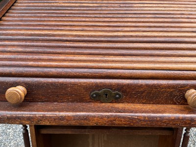 Lot 3225 - An oak roll top desk, height 101cm, width 72cm,...