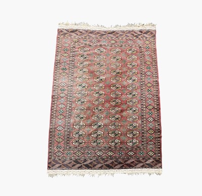 Lot 1227 - A Tekke carpet, mid 20th century, the madder...