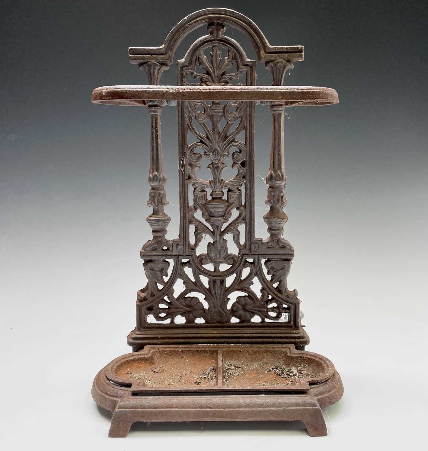 Lot 486 - A cast iron umbrella stand. Height 50cm, width...