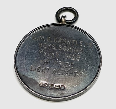 Lot 159 - An H.M.S. Dauntless silver Boys Boxing medal...