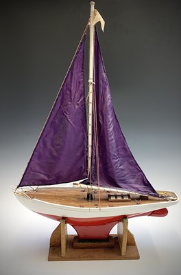 Lot 381 - A pond yacht, with red and white painted hull...