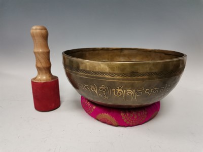 Lot 1 - A large handcrafted Tibetan singing bowl with...