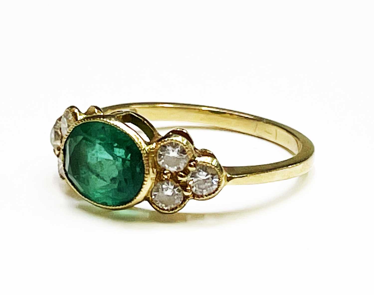 Lot 350 - An emerald and diamond ring, the oval