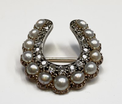 Lot 351 - A Victorian diamond and pearl horseshoe brooch...