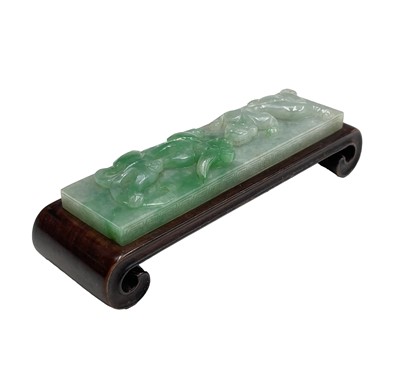 Lot 238 - An apple jade carved plaque, on a hardwood...