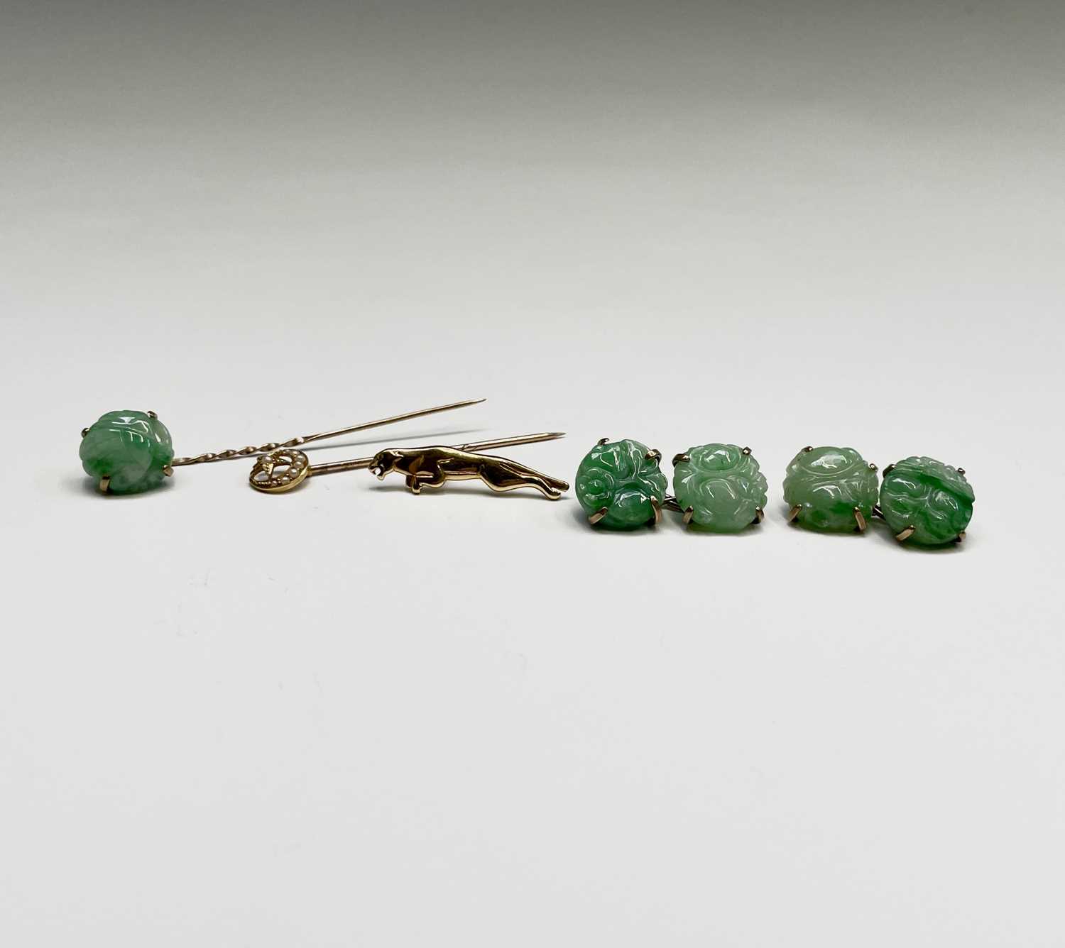 Lot 369 - A pair of 9ct gold mounted jade cufflinks...