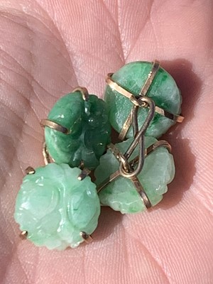 Lot 369 - A pair of 9ct gold mounted jade cufflinks...