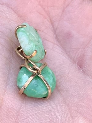Lot 369 - A pair of 9ct gold mounted jade cufflinks...