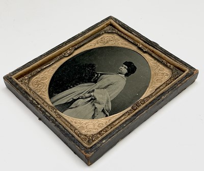 Lot 129 - An Ambrotype of a Victorian lady, heightened...