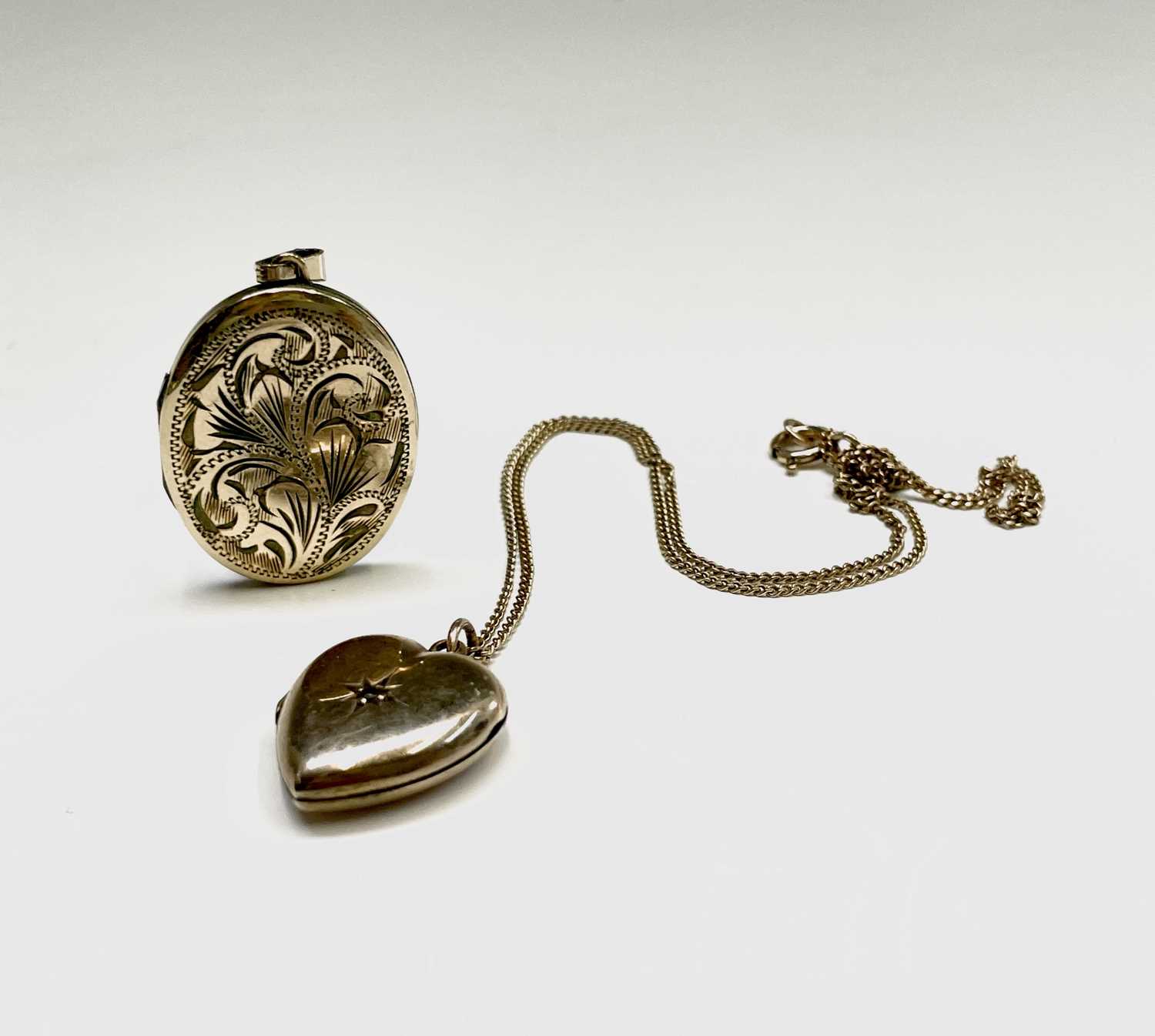 Lot 312 - A 9ct 44cm chain and two gilt lockets