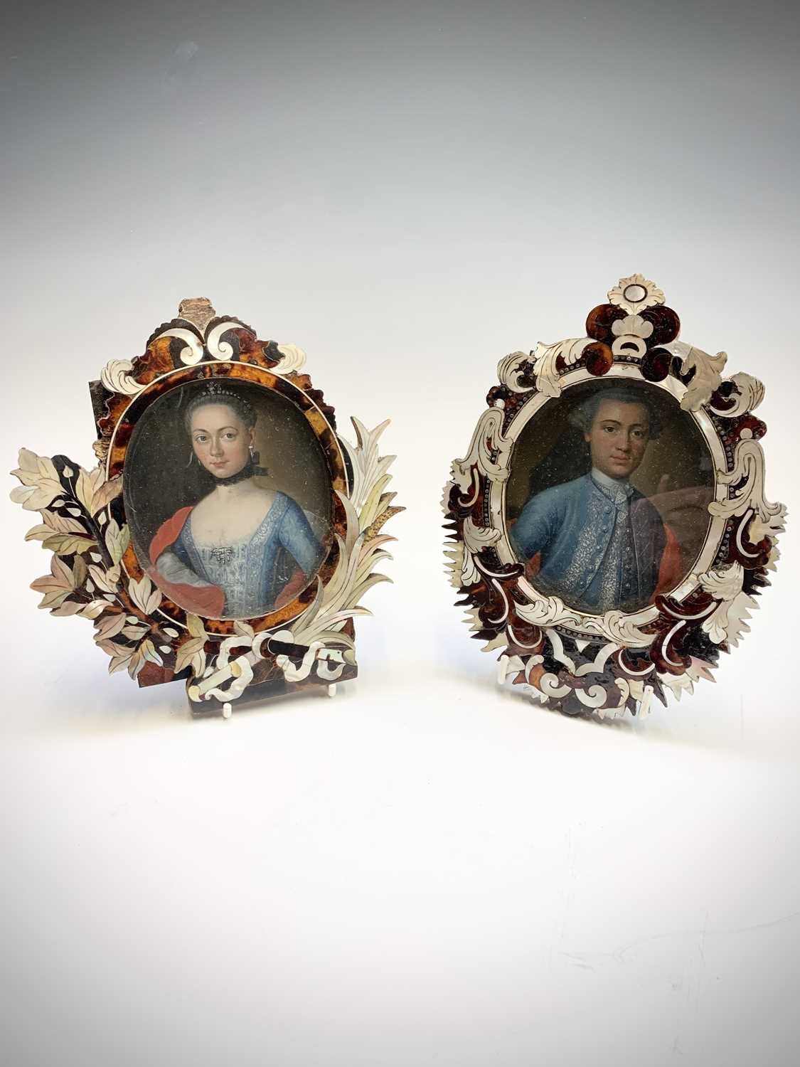 Lot 1 - A pair of 18th century portraits in similar...