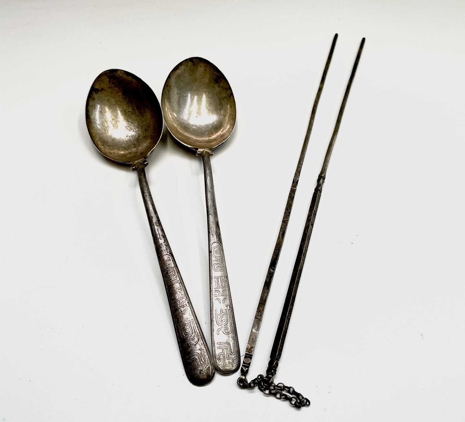 Lot 63 - A pair of Chinese silver presentation spoons...