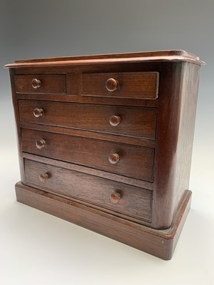 Lot 11 - A Victorian mahogany miniature chest of two...